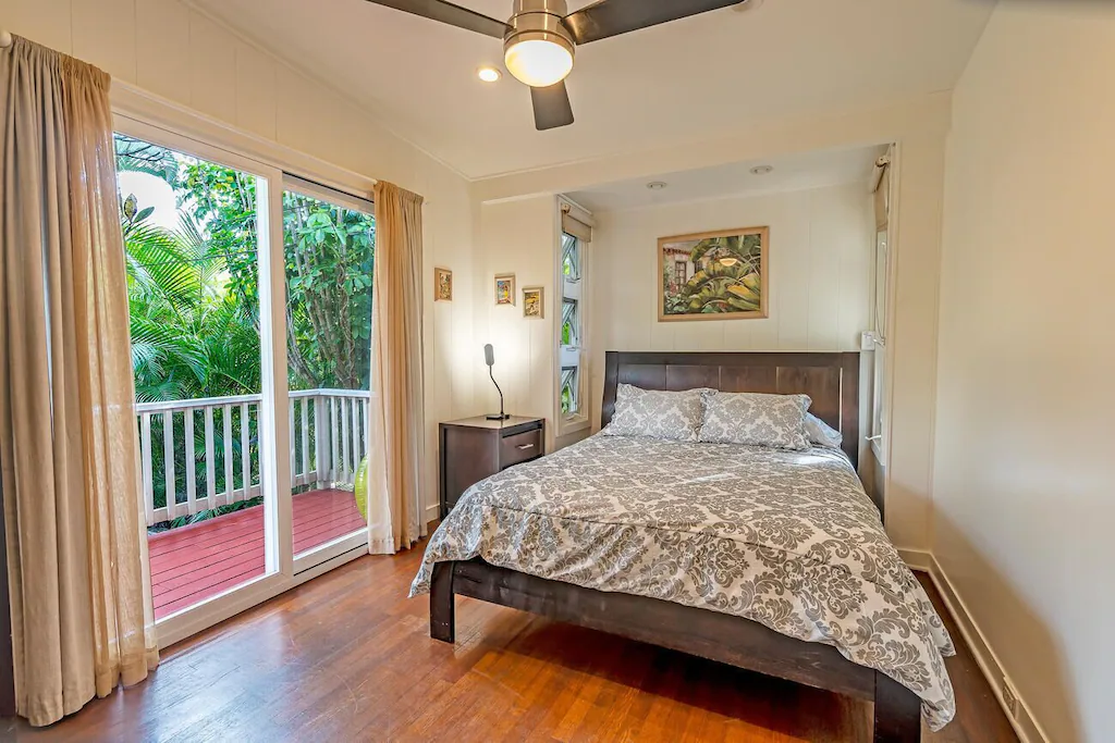The second bedroom has a terrace and a garden view.