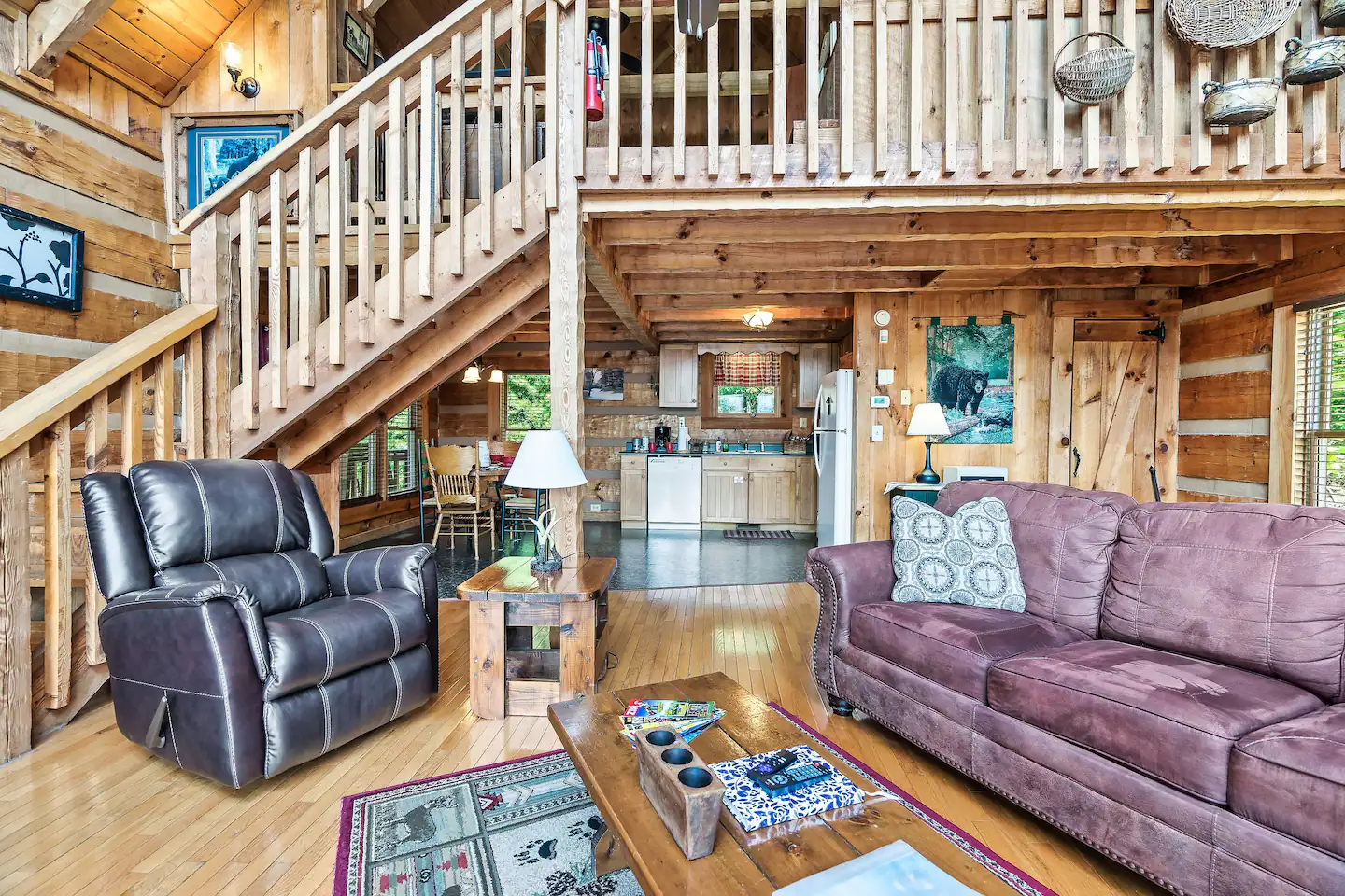 Furnished with a leather sleeper sofa with memory foam mattress, a rustic stone fireplace, and a flat screen TV to enjoy your favorite show or game