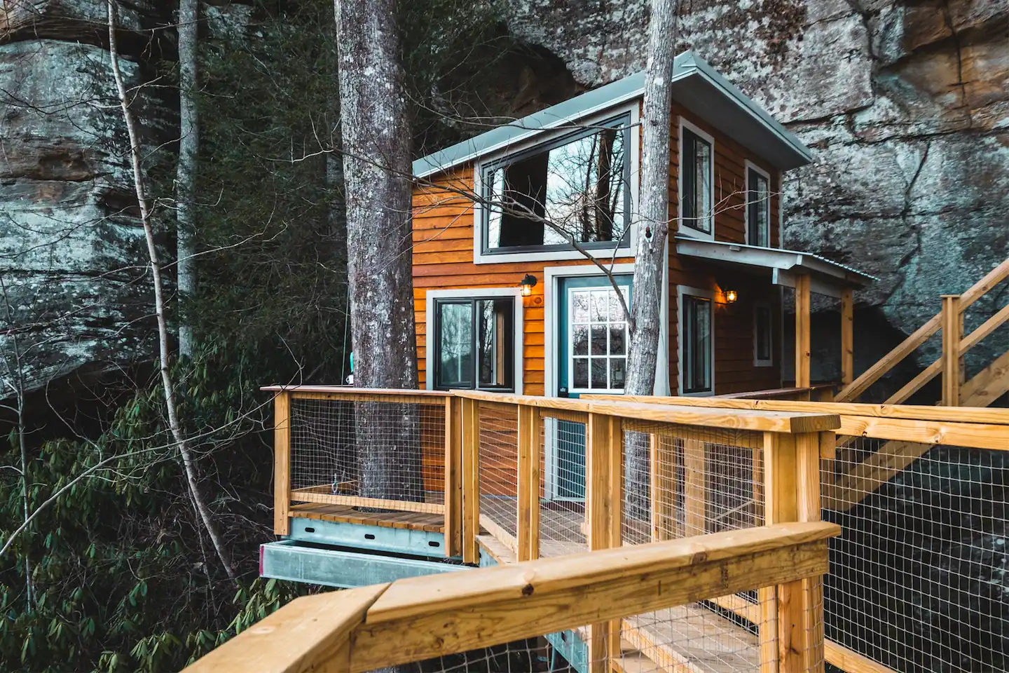 The first building houses the kitchen, bathroom, and bedroom loft.