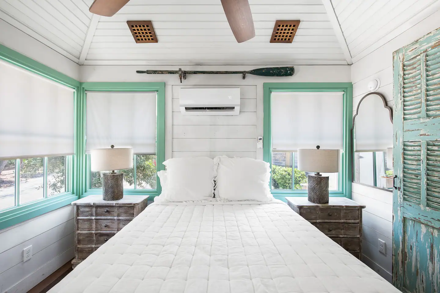 The inside of the house has a queen-size bed.
