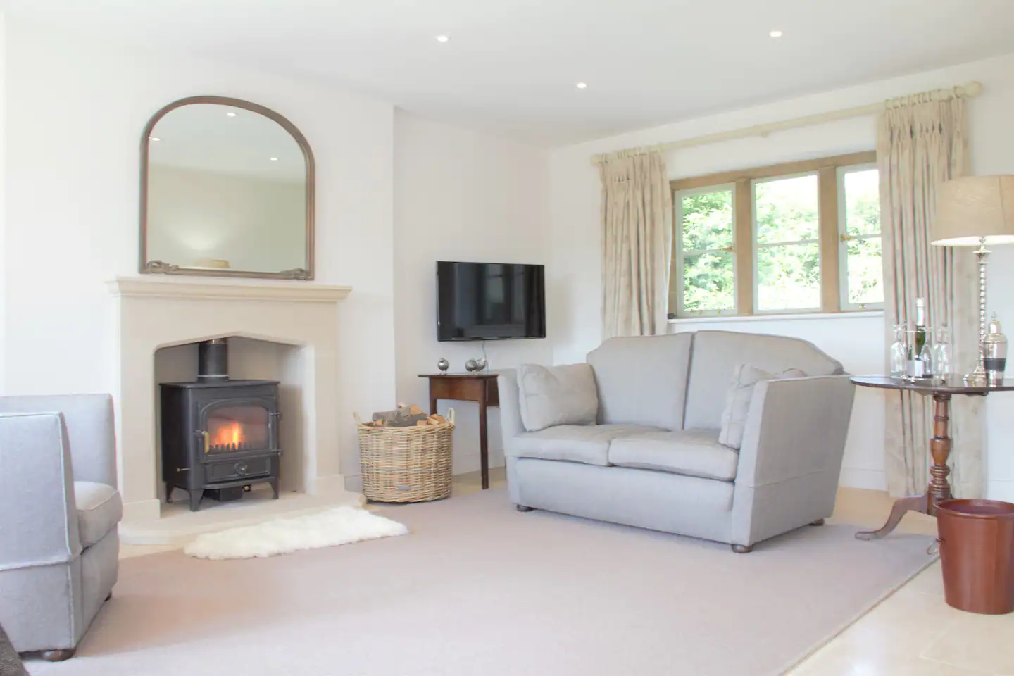 The sitting area has a cozy wood burner.
