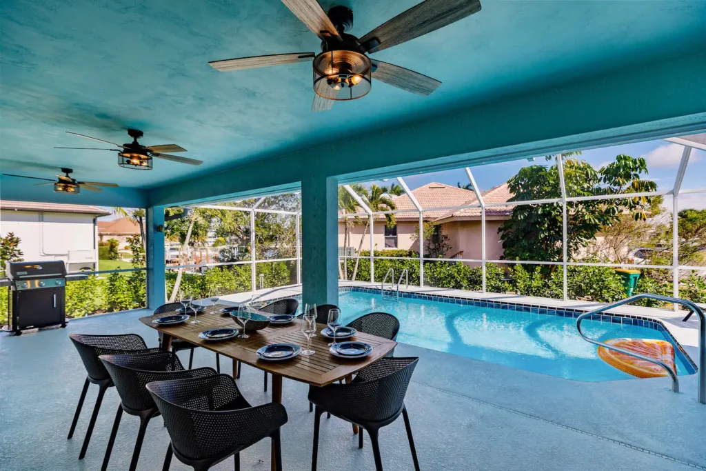 Amazing pool area including a screened and covered outdoor dining area with seating for 8.