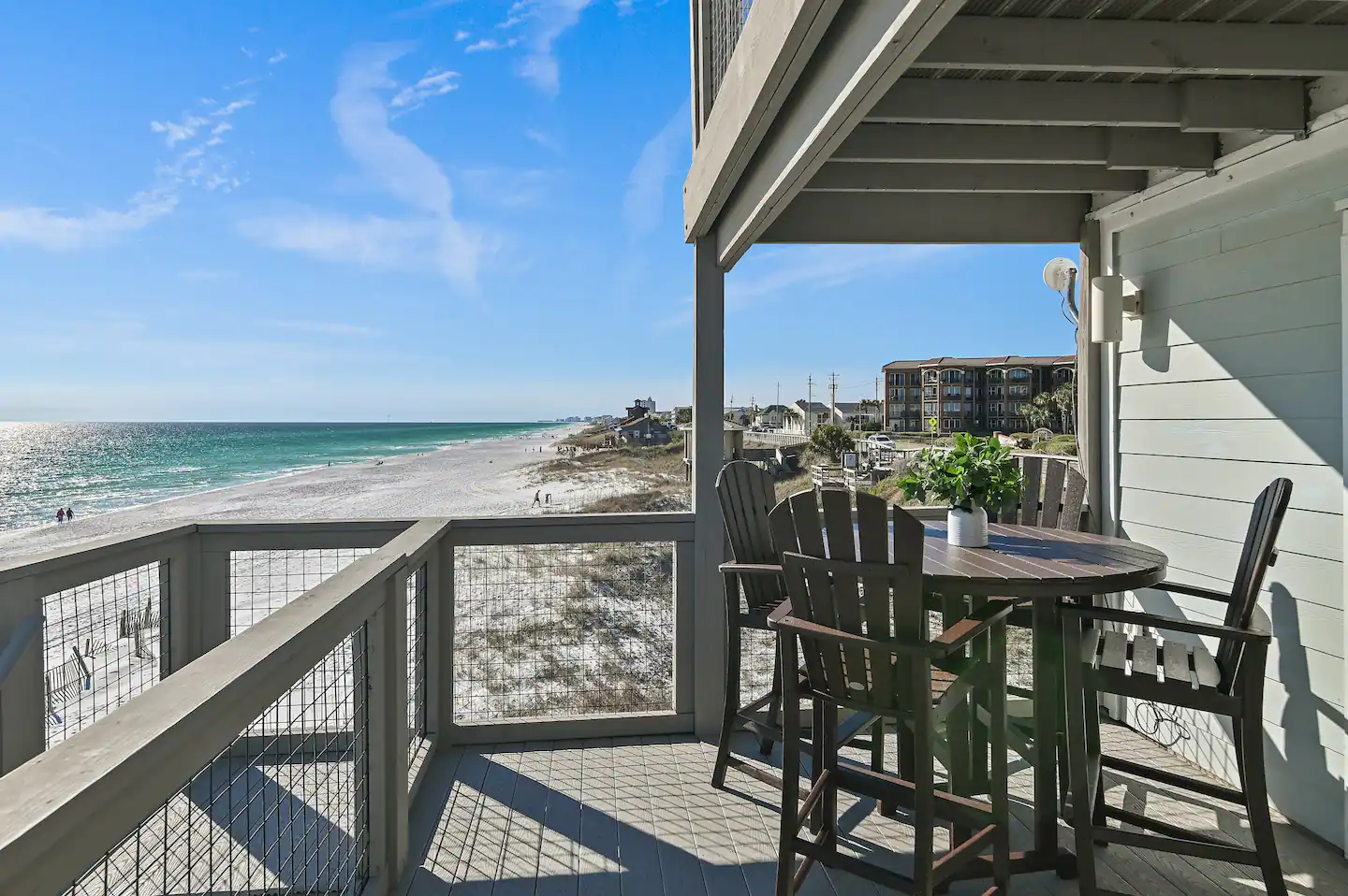 Balcony with seating overlooks the beautiful gulf.